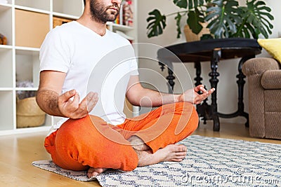 Close Up. Man practicing yoga and meditation at home. A series of yoga poses. Lifestyle concept Stock Photo