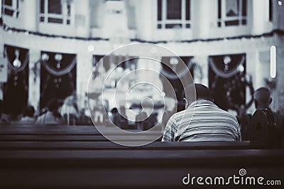 Man praying at church Editorial Stock Photo