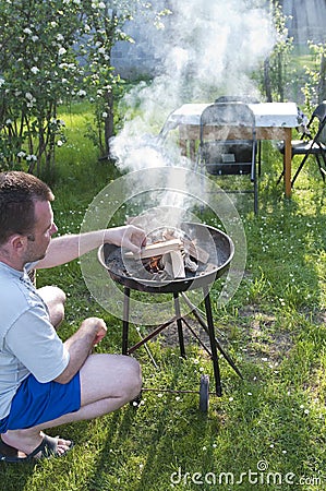 Man preparing barbecue Stock Photo