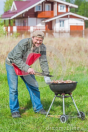 Man preparing barbecue Stock Photo