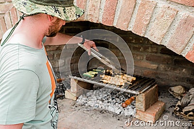 Man preparing barbeque on the grill Stock Photo