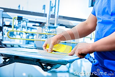 Man preparing fabric for screen printing. Stock Photo