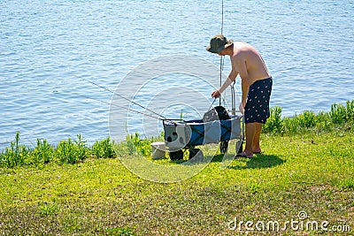 Man Preparing Fishing Equipment Editorial Stock Photo