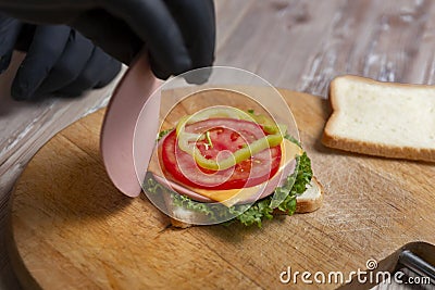 man preparing sandwiches Stock Photo