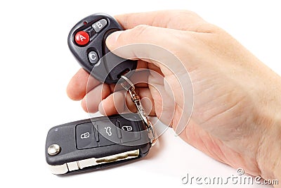 Man presses button on garage door remote control Stock Photo