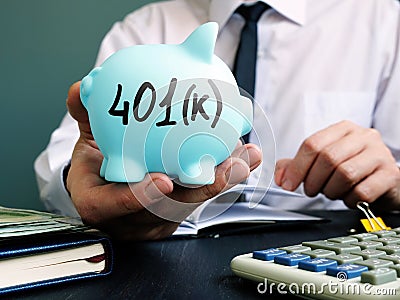 Man proposes piggy bank with sign 401k. Retirement pension plan Stock Photo