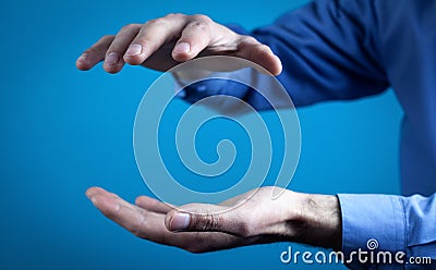 Man with protecting hands. Protecting gesture Stock Photo