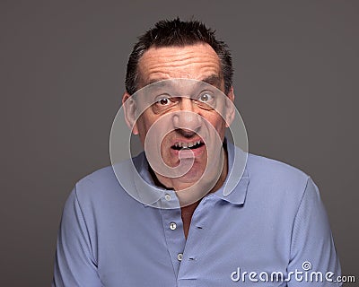 Man Pulling Funny Grimace Face Stock Photo