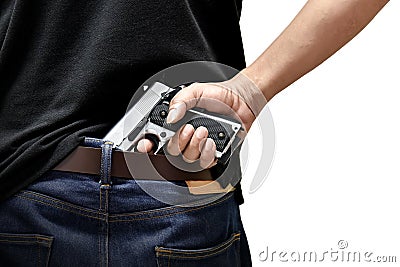 The man pulls out a gun Stock Photo