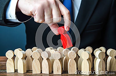 Man pulls the red man out of the crowd. Different, special. Infected. Intruder detection. Collective immunity. Dissent, Stock Photo