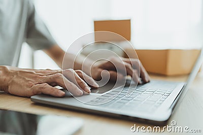 Man purchase or shopping online at home via internet. Businessperson or entrepreneur using laptop working for customer or client Stock Photo