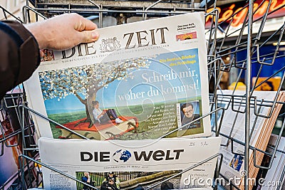 Man purchases a newspaper from press kiosk after London attack Editorial Stock Photo