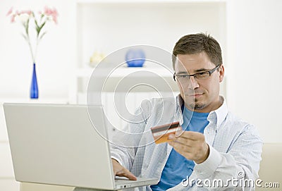 Man purchasing by credit card Stock Photo