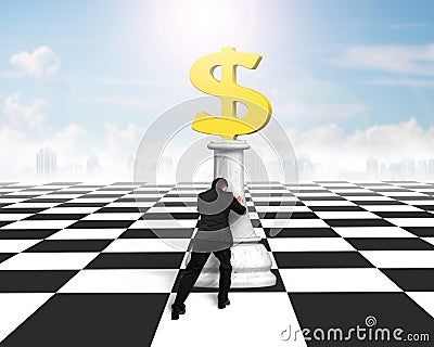 Man pushing money chess of golden dollar currency Stock Photo