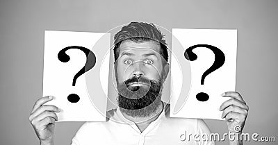 Man with question mark. Paper notes with question marks. Beard man question mark, solution problems. Thinking man with Stock Photo