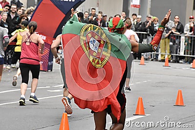 Man racing with Portugese flag Editorial Stock Photo