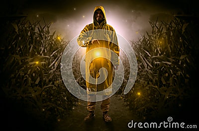 Man coming out from a thicket with lantern Stock Photo