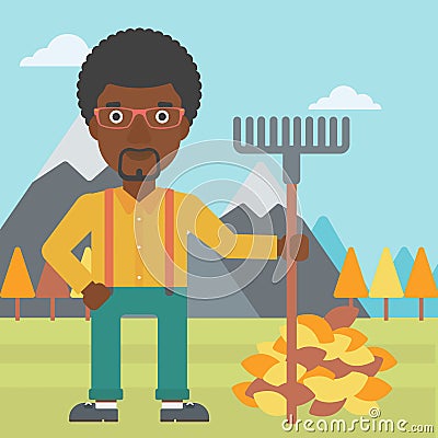Man with rake standing near heap of autumn leaves. Vector Illustration