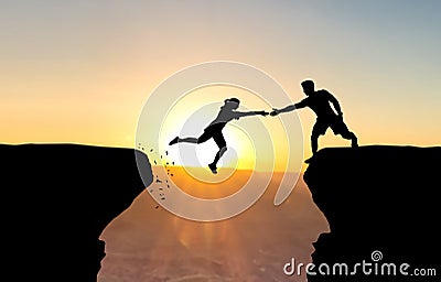 Man reaching hand to woman jumping over abyss. Stock Photo