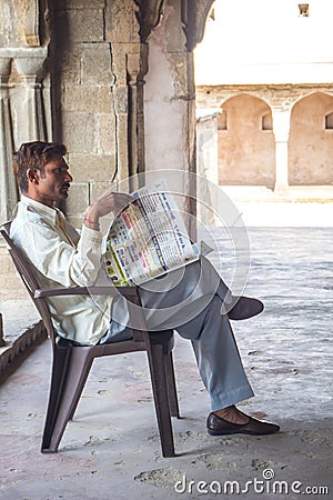 The man read Newspaper at Chand Baori Stepwell in the village of Abhaneri, Rajasthan,Jaipur,INDIA Editorial Stock Photo