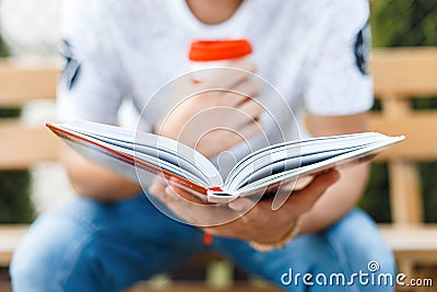 Man reading a book and drinking coffee.Young man resting Stock Photo