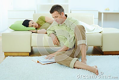 Man reading book at home Stock Photo