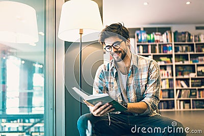 Man reading book in the library Stock Photo