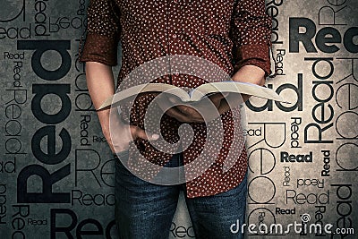 Man reading a book and the word Read on the background Stock Photo
