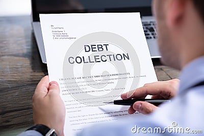 Man Reading Debt Collection Letter Stock Photo