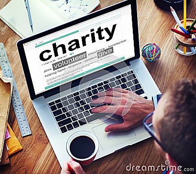 Man Reading the Definition of Charity Stock Photo