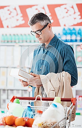 Man reading food labels Stock Photo