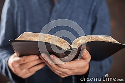 Man reading the holy bible Stock Photo