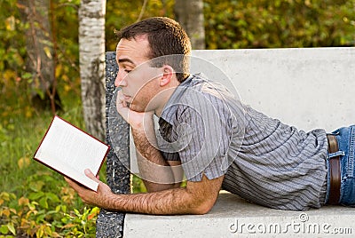 Man Reading A Novel Stock Photo