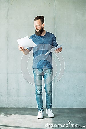 Man reading script papers focused screen writer Stock Photo