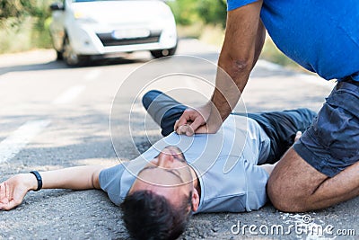 Man receiving first aid after a car accident Stock Photo