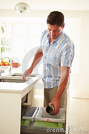 Man Recycling Kitchen Waste In Bin Stock Photo