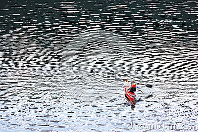 BELIS-FANTANELE, ROMANIA, AUGUST 12, 2023: Red kayak on Belis-Fantanele dam lake, Ocidental Carpathians, Romania, Europe. Editorial Stock Photo