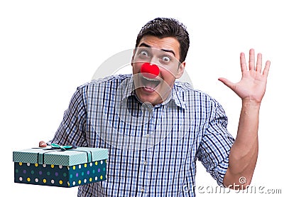Man with a red nose funny holding a shopping bag gift present is Stock Photo