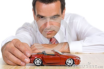 Man with red toy car Stock Photo