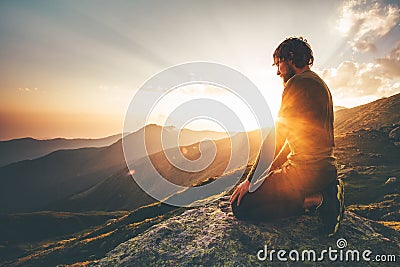 Man relaxing at sunset mountains Travel Lifestyle Stock Photo