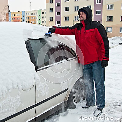 Man removing snow from car Stock Photo