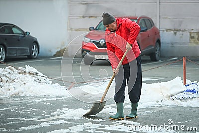 Man removing snow Editorial Stock Photo