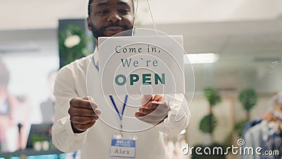 Man reopening clothing shop Stock Photo