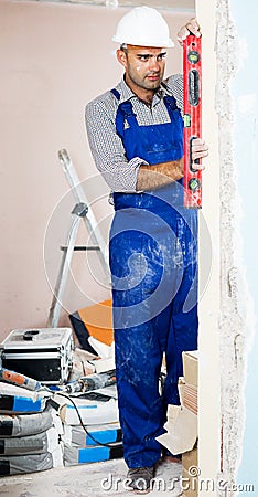 Man repairer working with spirit level Stock Photo