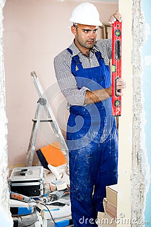 Man repairer working with spirit level Stock Photo