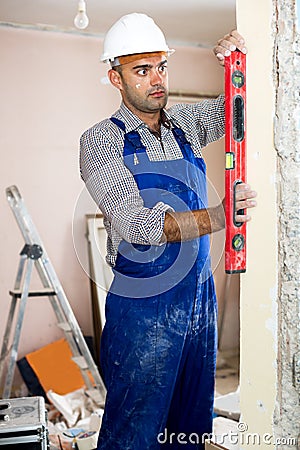 Man repairer working with spirit level Stock Photo