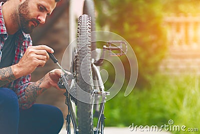 Man repairing bike Stock Photo