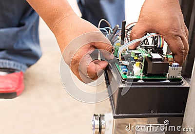 Man repairing electronic control system Stock Photo