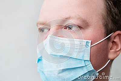 Man in respiratory mask, closeup portrait. Doctors face close up. Influenza, quarantine, coronavirus concept Stock Photo