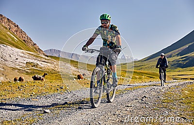 Man ride bicycle in the mountains Stock Photo